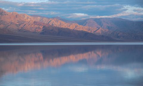 Water reflecting the clouds and mountains