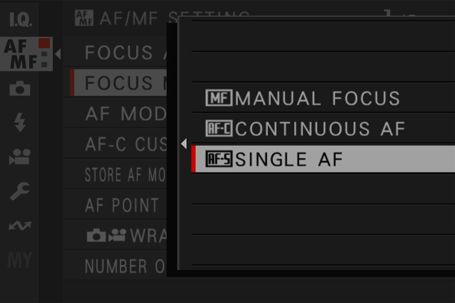 Camera menu displaying focus settings with options for Manual Focus, Continuous AF, and Single AF highlighted