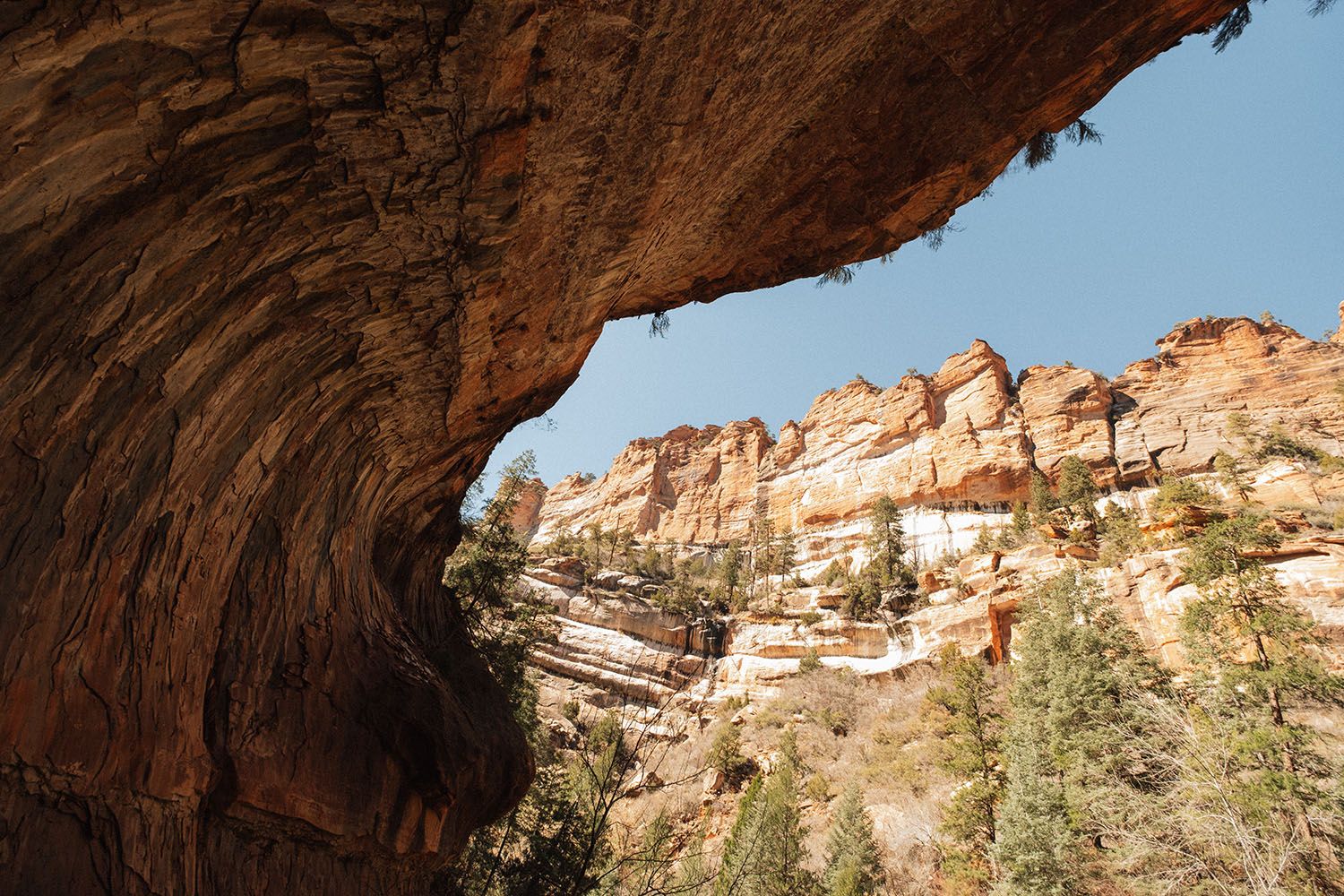 A overhanging cliff in shadow
