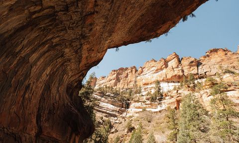 A overhanging cliff in shadow